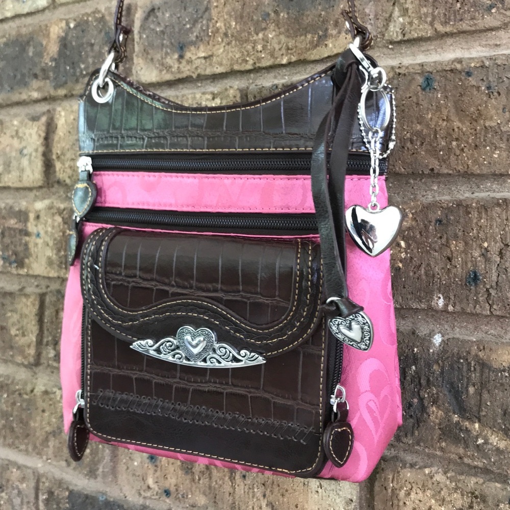Cute pink shoulder bag with heart charms